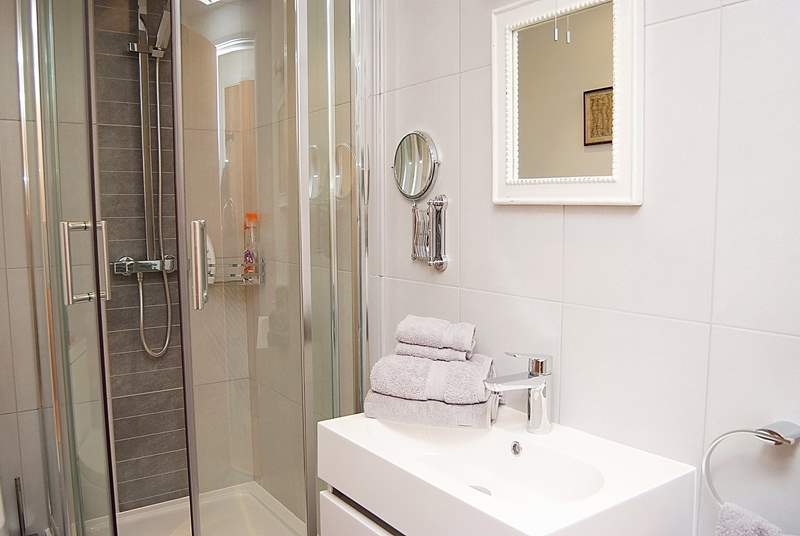 The fresh white shower-room for Bedroom 1.