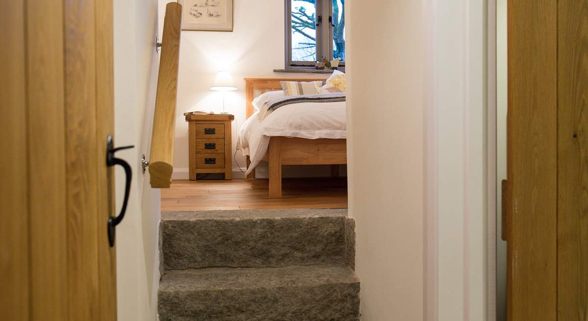 The granite steps that lead up to Bedroom 1, add to the overall character of the Barn.