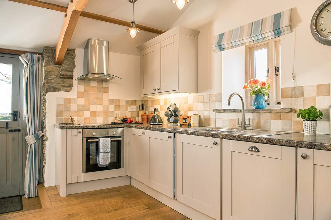 The stylish kitchen is well-equipped.