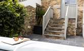 The steps lead from the patio to the back door. - Thumbnail Image