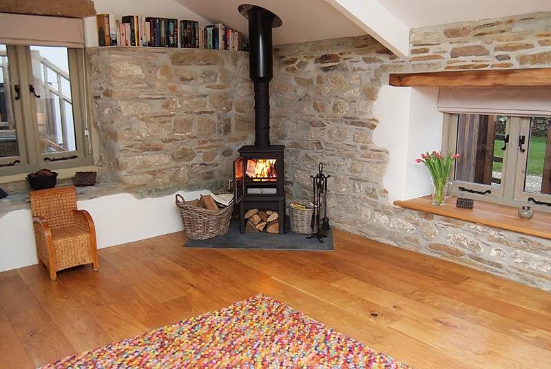The cosy wood-burner gives extra heat in the living-room.