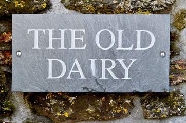 The name carved in slate is by the front door.