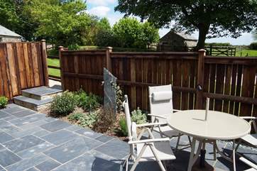 The sunny enclosed patio behind The Old Dairy.