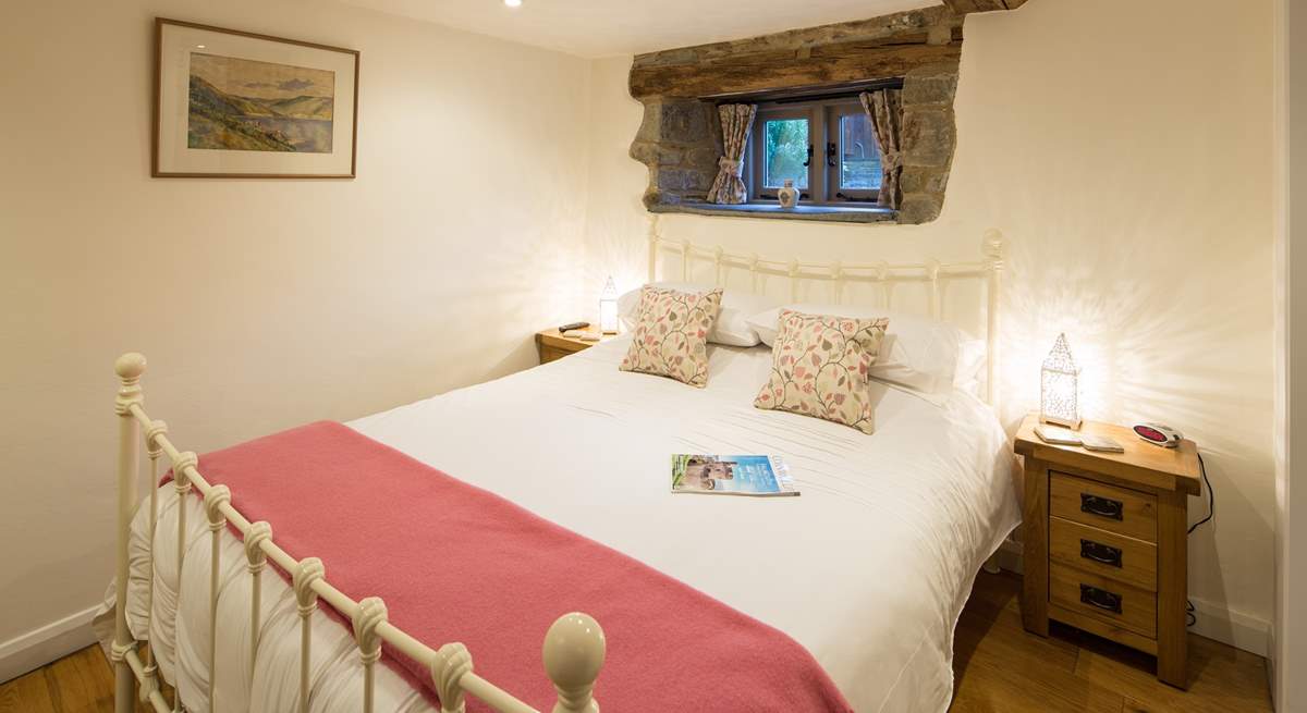 Bedroom 1 has a lovely brass bed.