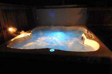 The hot tub is perfect for a night time soak.