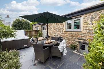 The Old Dairy has delightful outside space with a fabulous hot tub.