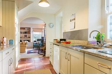 The kitchen is light and airy, and enjoys views over the back garden.