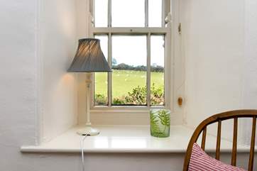 The cottage is surrounded with open countryside.