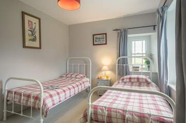 The pretty twin bedroom.