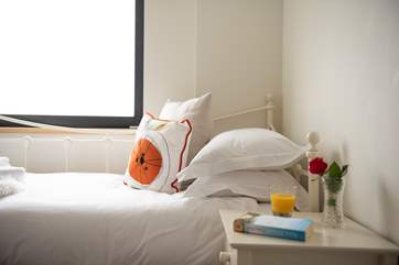 Bedroom 2 has a cute day bed.