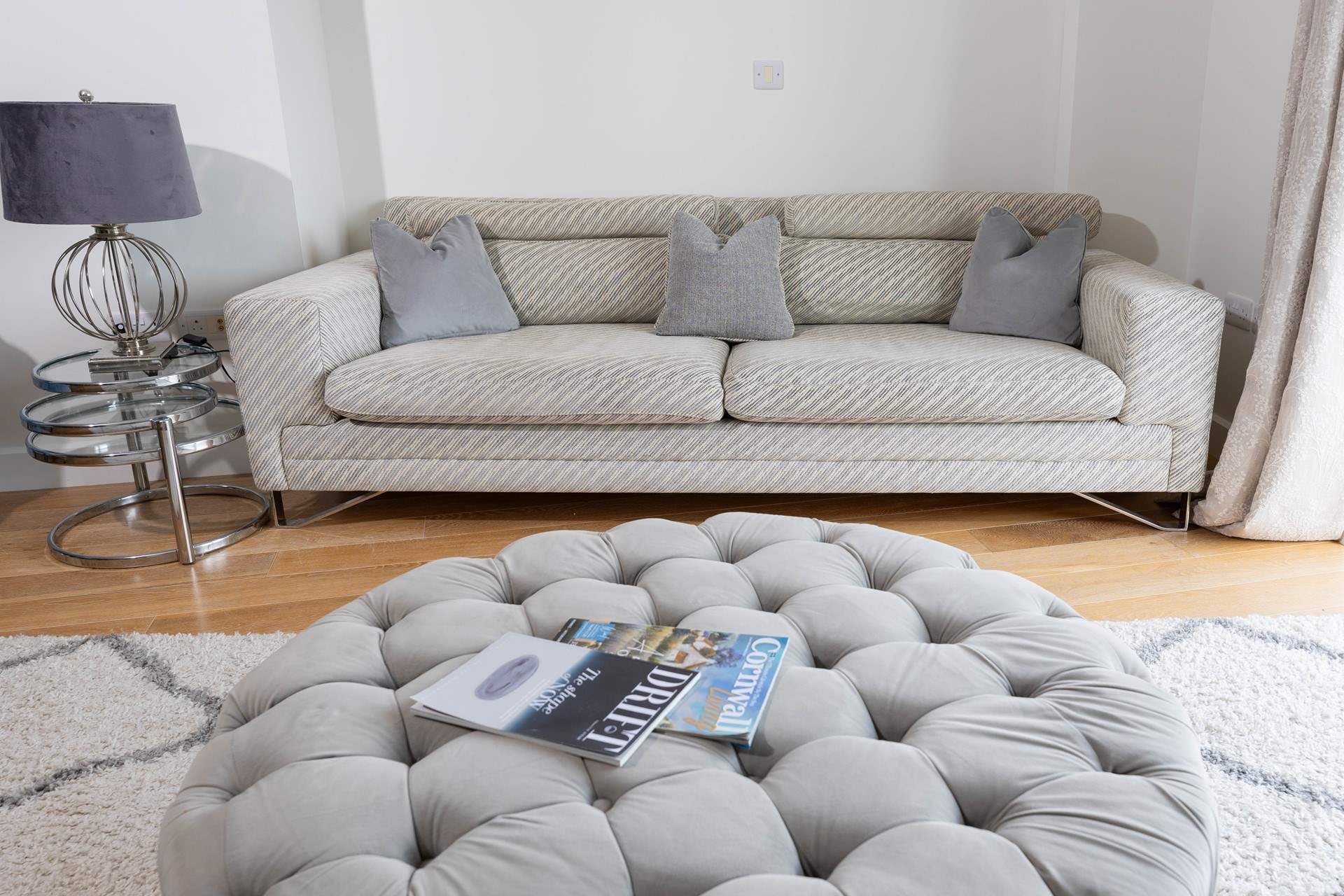 A stylish and inviting sofa offering ultimate comfort, sit back and relax and enjoy the opulence of this apartment.