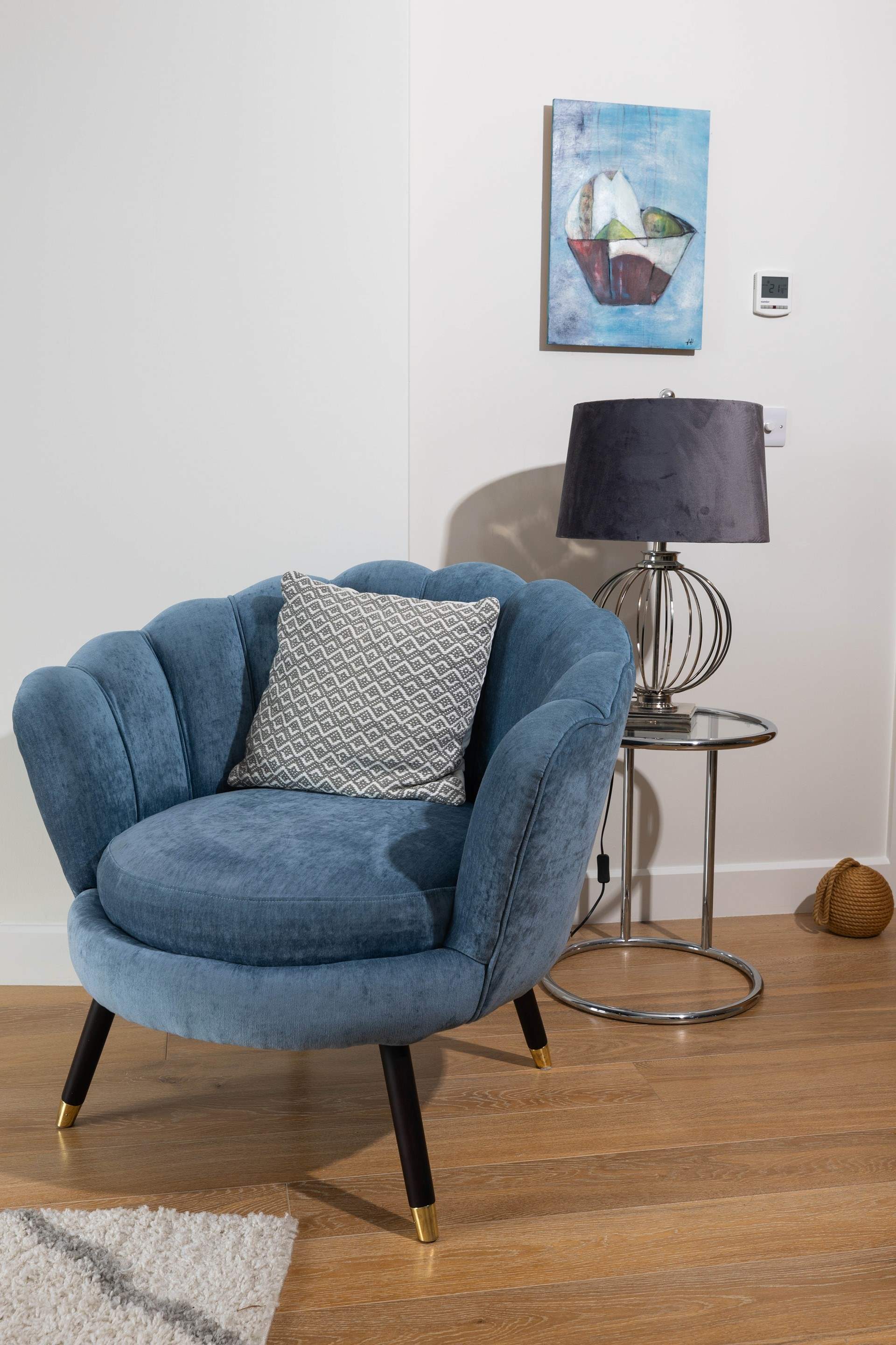 Sit back in the stylish seashell chair.