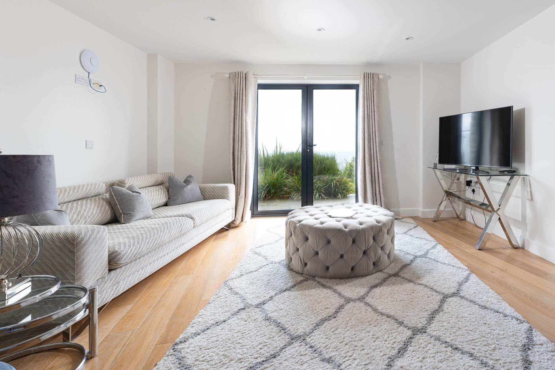 Throw open the floor to ceiling doors and step onto the terrace overlooking St Ives to the left and Godrevy lighthouse to the right.