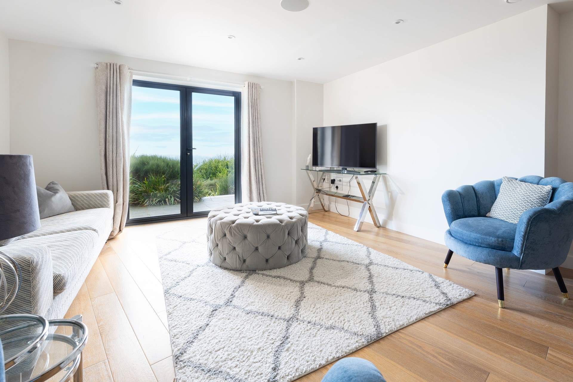 The view from Windjammer from the open living space captures the serene beauty of this coastal Cornish landscape.