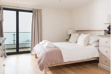The calm and pretty main bedroom.