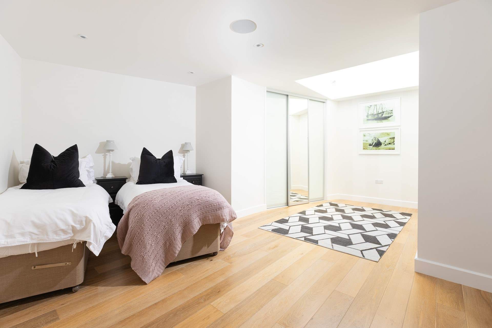 Spacious bedroom 2 is filled with natural light.