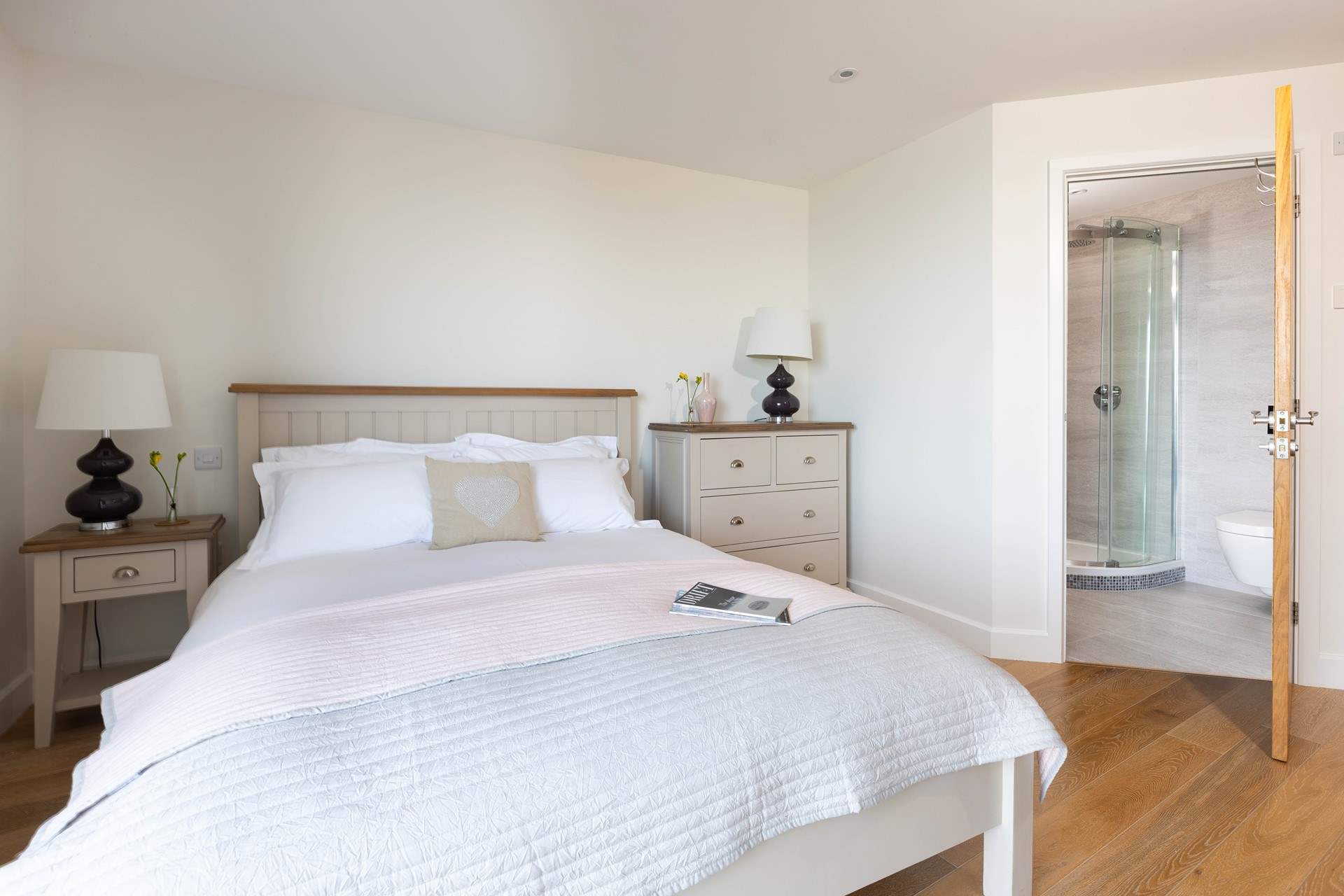 Fall out of bed and jump straight into the power shower in this premium en suite shower-room.