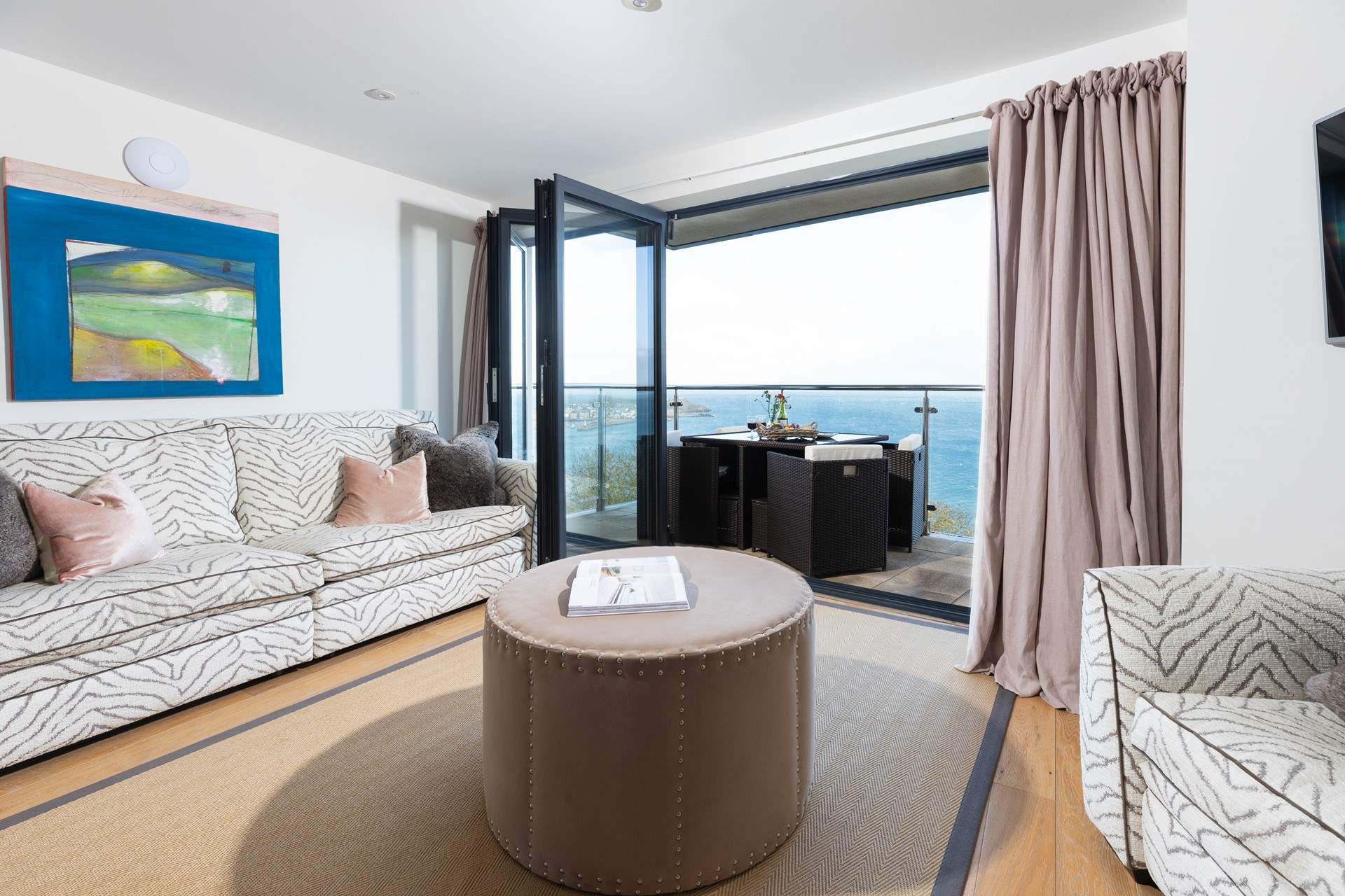 The contemporary open plan living space creates a place that feels spacious, bright and deeply connected to the beauty of the surrounding sea.