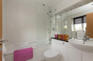 This is the family bathroom, with bath and fitted shower.