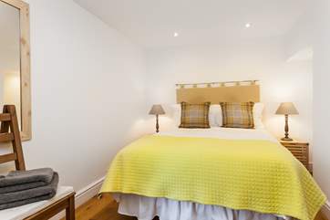 The pretty bedroom is a calm sanctuary.