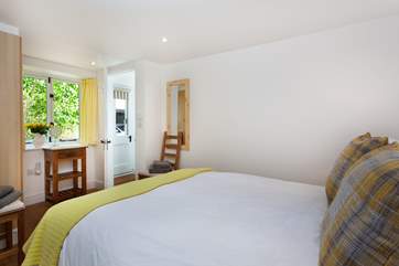 The master bedroom has a super comfy bed.