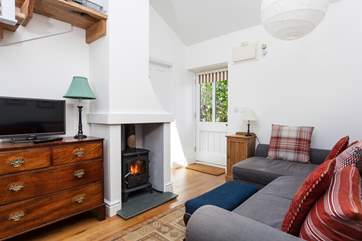 The front door opens into the open plan living-room with a very comfy L-Shaped sofa.