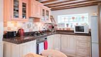 The kitchen is well-equipped, a friendly home-from-home.