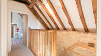 The two bedrooms are at opposite ends of the first floor corridor.
