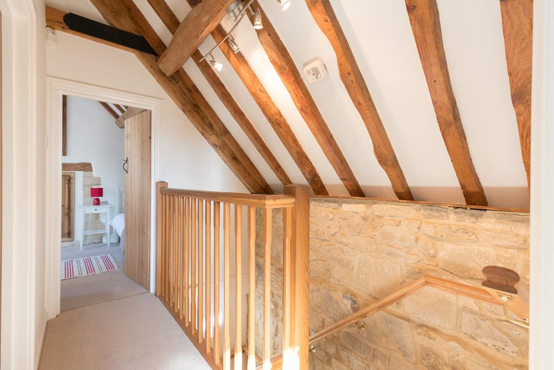 The two bedrooms are at opposite ends of the first floor corridor.