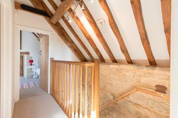 The two bedrooms are at opposite ends of the first floor corridor.