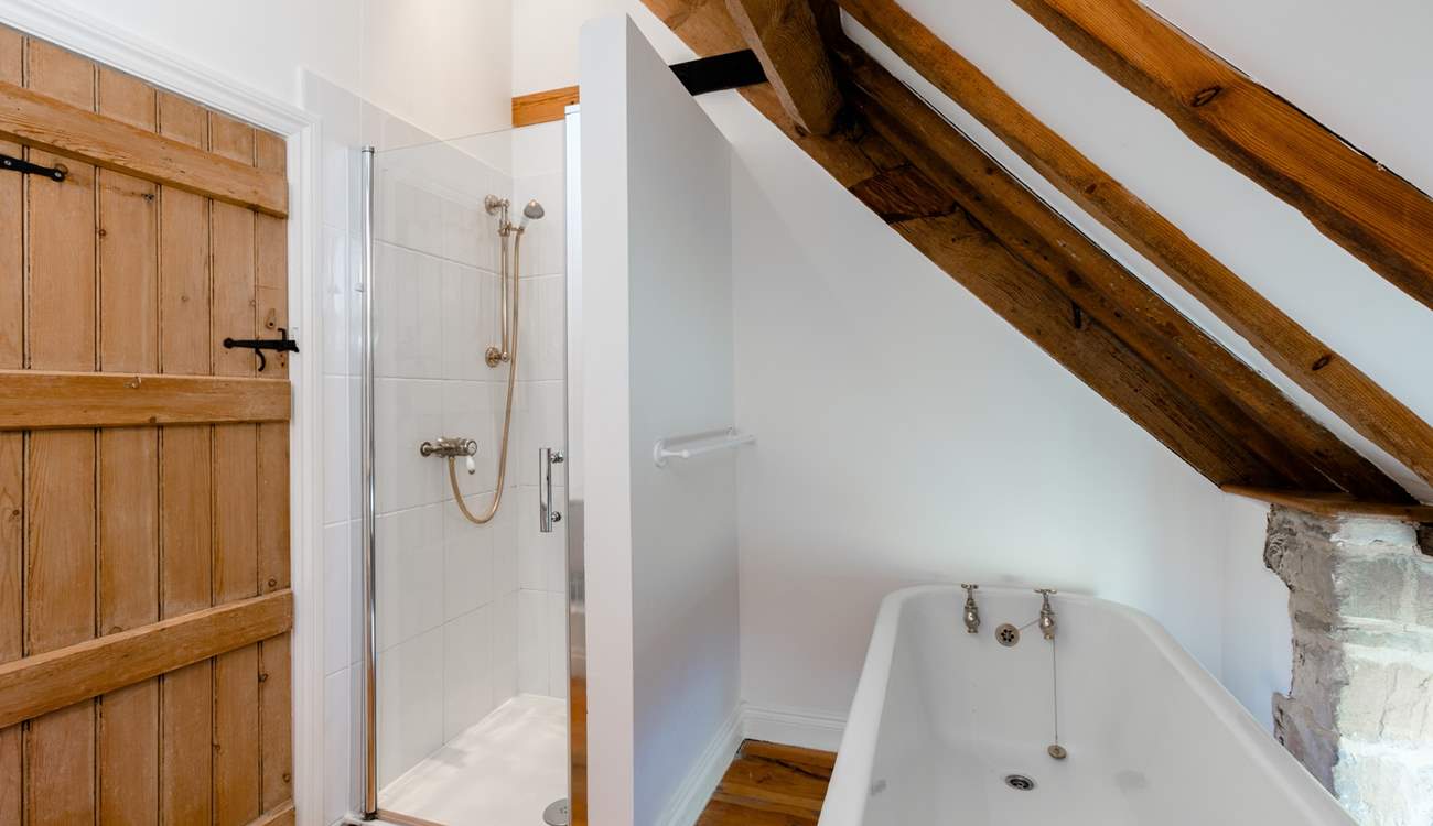 The family bathroom, with roll top bath and separate shower cubicle.