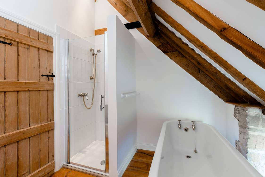 The family bathroom, with roll top bath and separate shower cubicle.