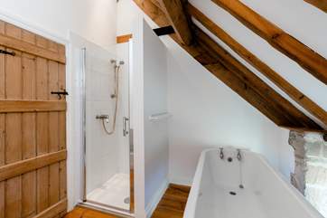 The family bathroom, with roll top bath and separate shower cubicle.