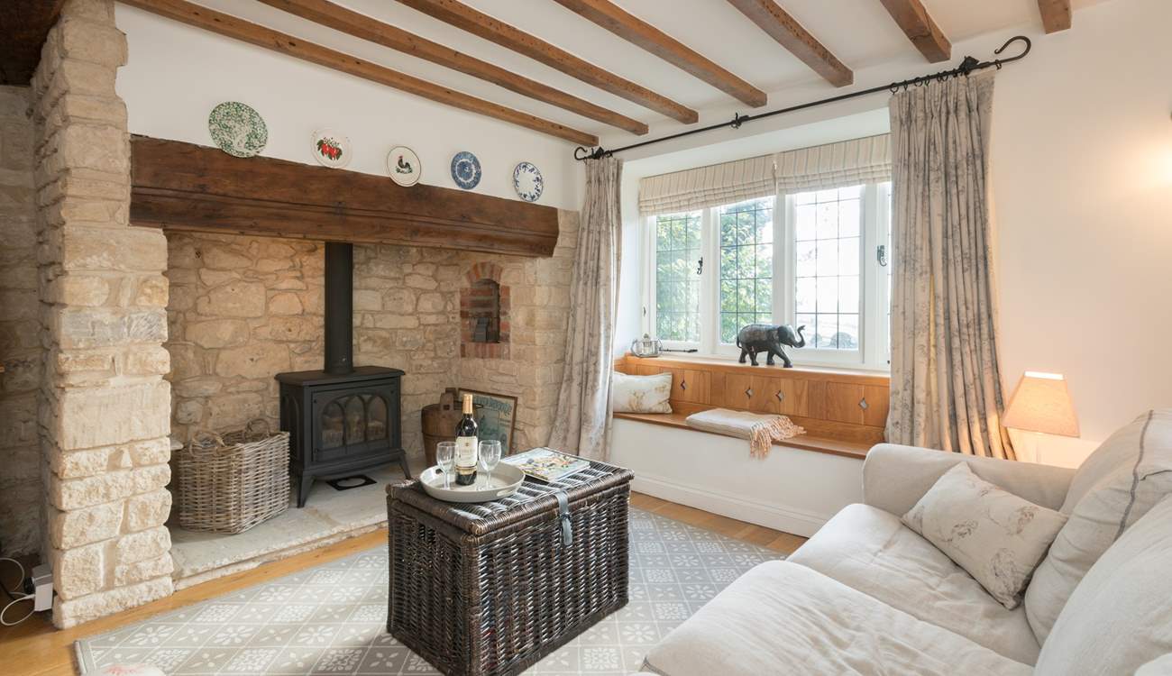 The characterful sitting-room has a wood-burner effect gas stove for extra warmth.
