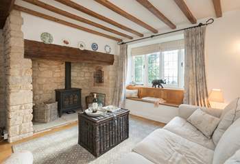 The characterful sitting-room has a wood-burner effect gas stove for extra warmth.