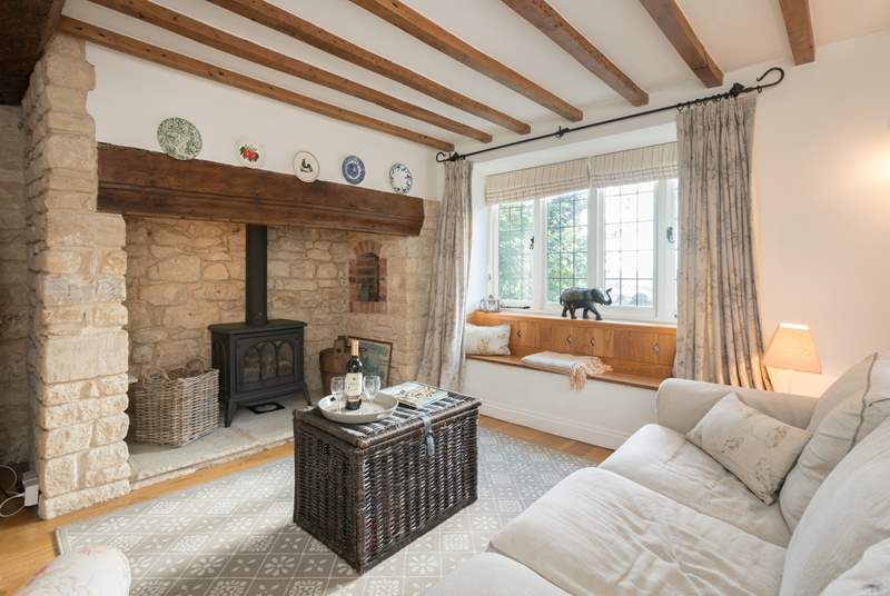 The characterful sitting-room has a wood-burner effect gas stove for extra warmth.