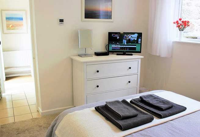 A TV in the bedroom for those long lazy lie-ins.