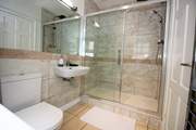 The shower-room boasts a huge shower and modern fittings.