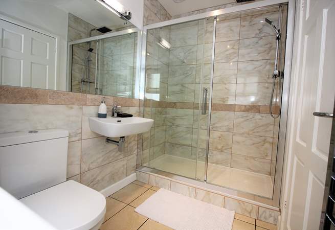 The shower-room boasts a huge shower and modern fittings.