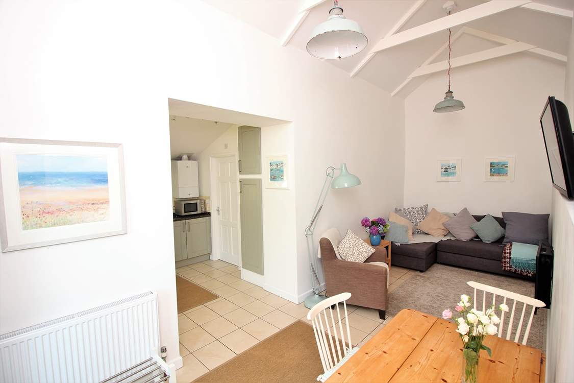 The open plan living-room with kitchen and dining-areas.