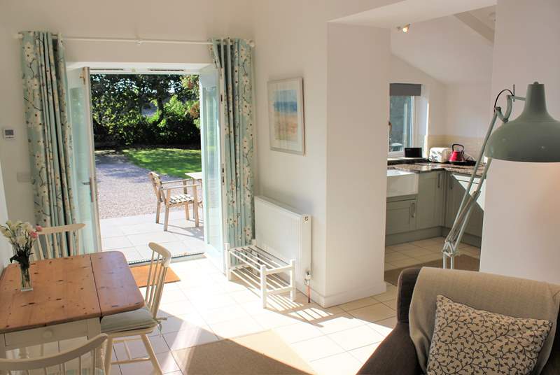 Looking from the sitting-area towards the kitchen and dining-areas - a lovely airy open plan room.