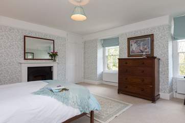 This is the exceptionally spacious master bedroom with dual-aspect windows overlooking the river Barle.
