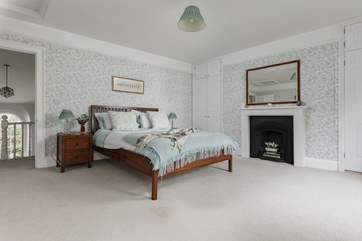 This is the exceptionally spacious master bedroom has dual-aspect windows overlooking the river Barle.