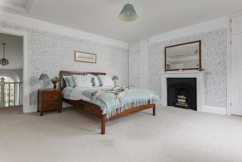 This is the exceptionally spacious master bedroom has dual-aspect windows overlooking the river Barle.