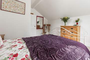 The second bedroom is comfy and cosy.