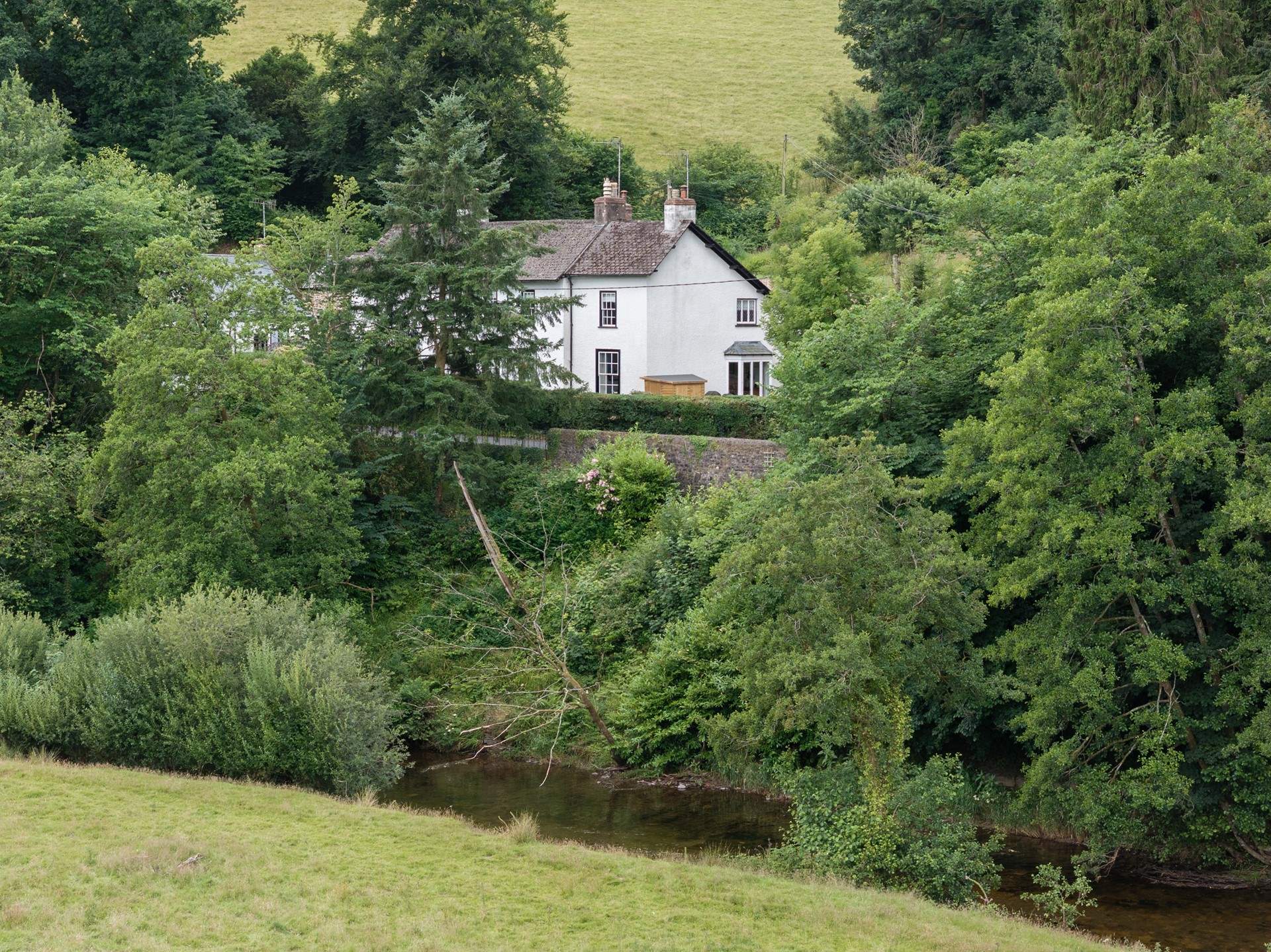 Andrews House is framed beautifully by the River Barle