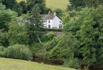 Andrews House is framed beautifully by the River Barle