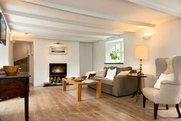The restful sitting-area has a wood-burner making this an ideal retreat all year round.