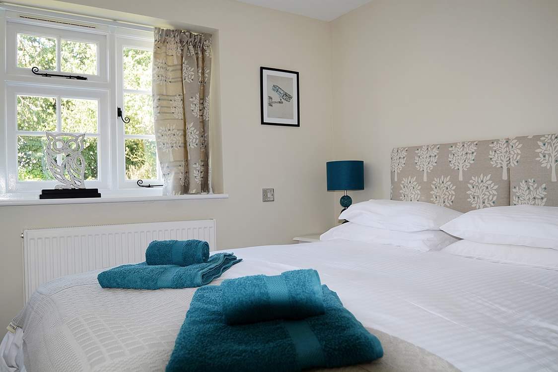 The bedroom is snug and has lovely co-ordinated linens.