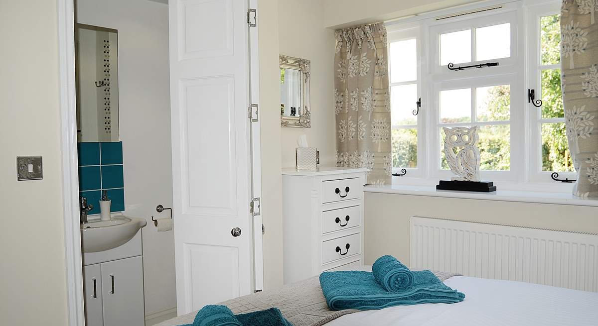 A folding door leads from the bedroom to the shower-room.